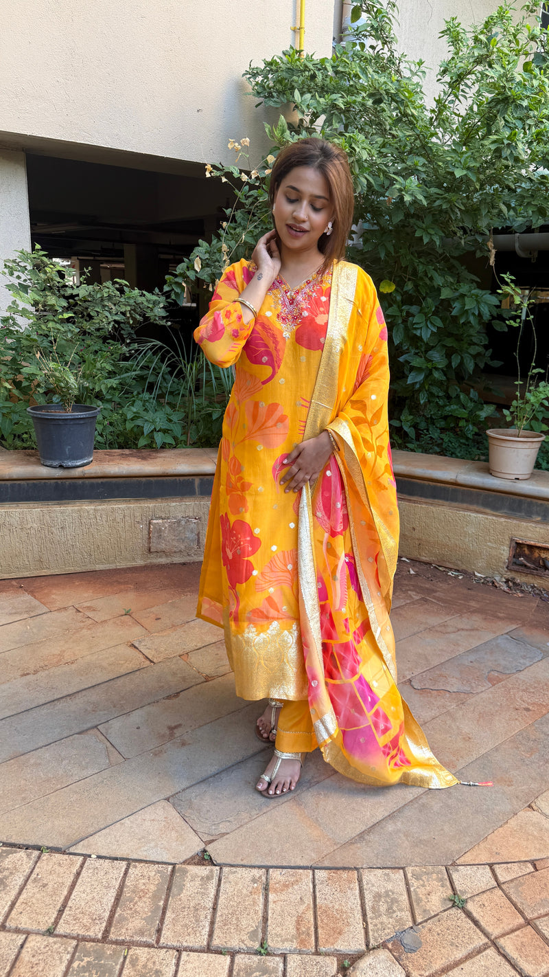 Front view of yellow kurta with subtle embroidered detailing and floral printed dupatta