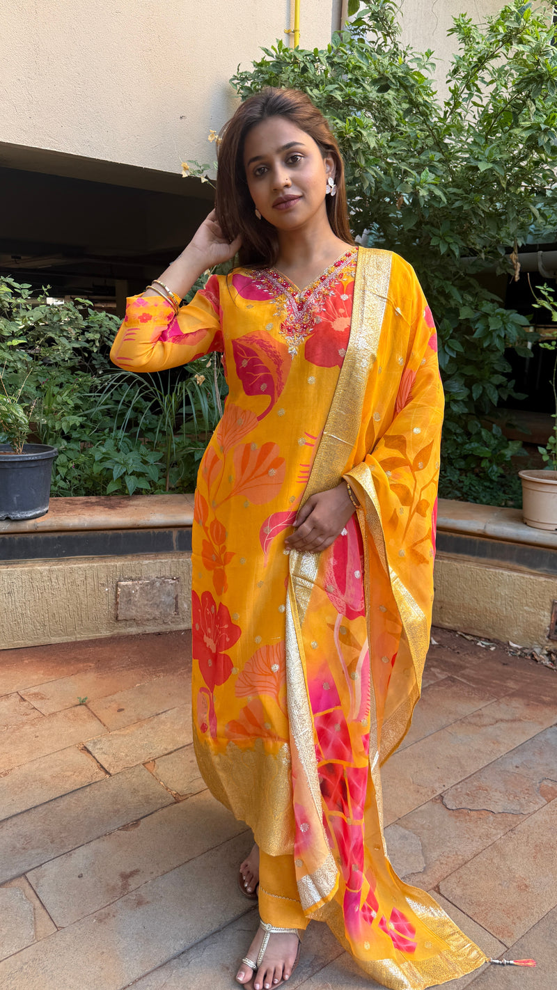 Side view of yellow kurta showing dupatta drape and printed motifs