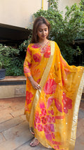 Full-length view of yellow organza kurta with floral printed dupatta
