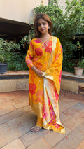 Detail of pink and orange floral block print on yellow dupatta