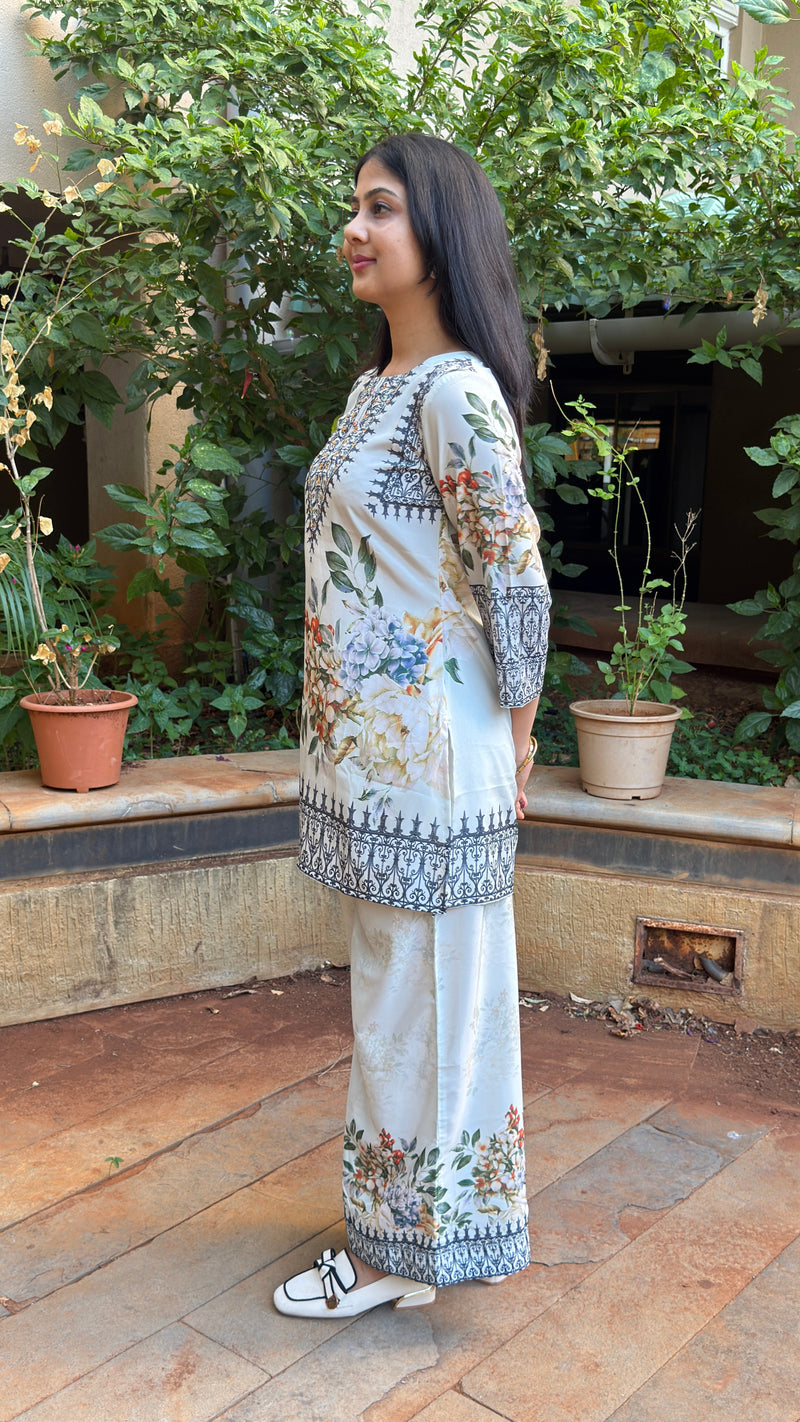Front view of ivory short kurta with embroidered yoke and floral print body