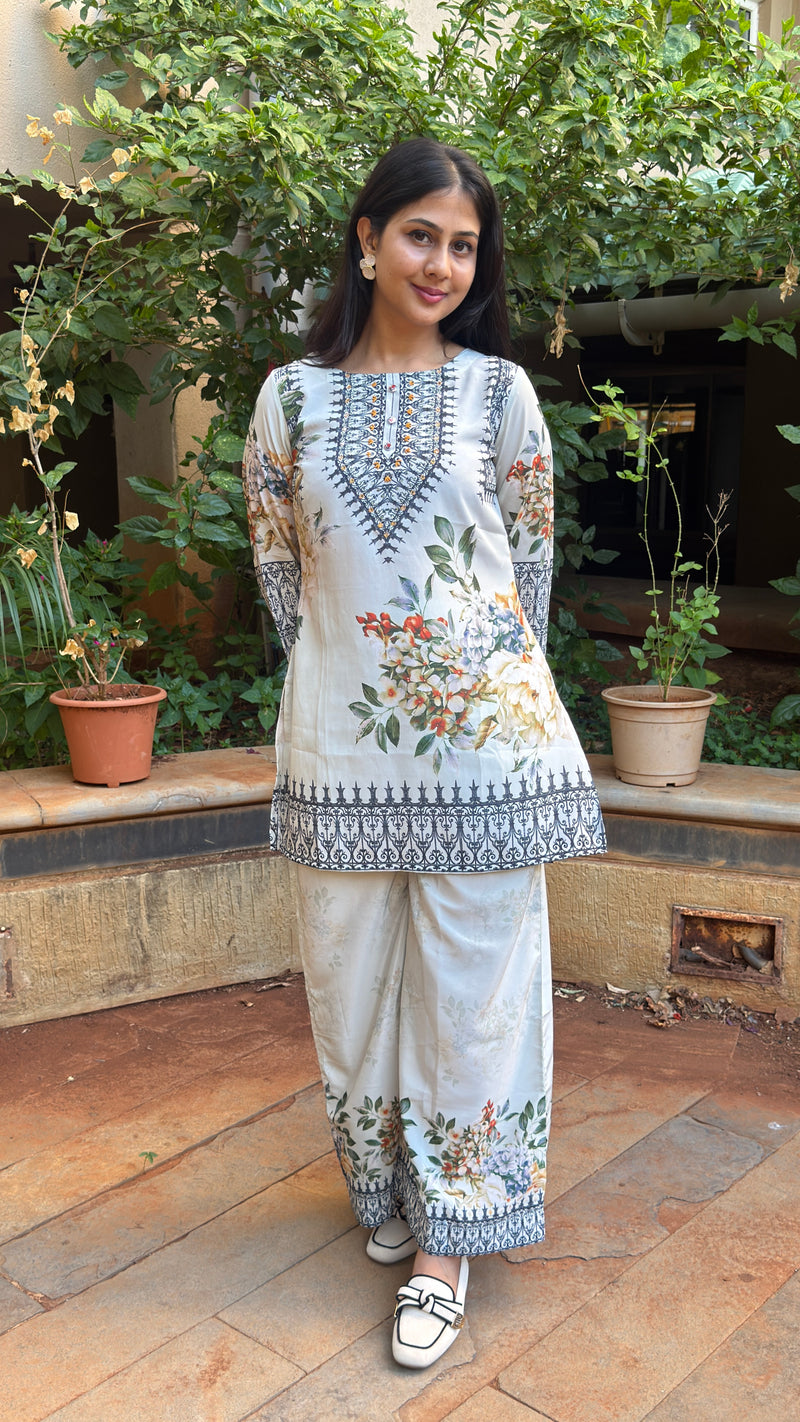 Side view of short kurta showing printed hem on pants