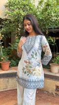 Full-length view of ivory printed short kurta set