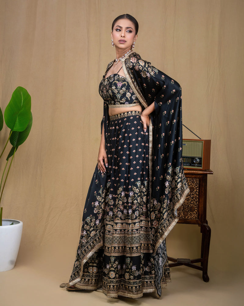 Full-length view of black floral modal cape set with open jacket and wide trousers