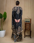 Detailed shot of mirror work and floral embroidery on black modal top and waistband