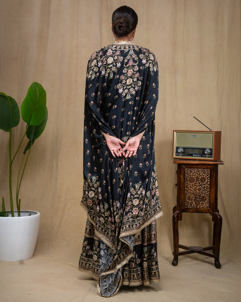 Detailed shot of mirror work and floral embroidery on black modal top and waistband