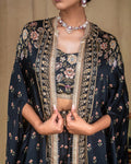 Texture detail of the hand embroidered floral pattern on black modal fabric bodice