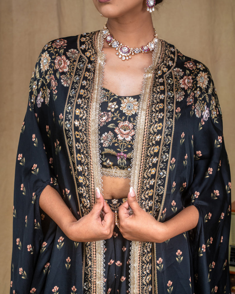 Texture detail of the hand embroidered floral pattern on black modal fabric bodice