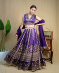 Detailed front view of deep purple embroidered skirt with metallic lace border panels
