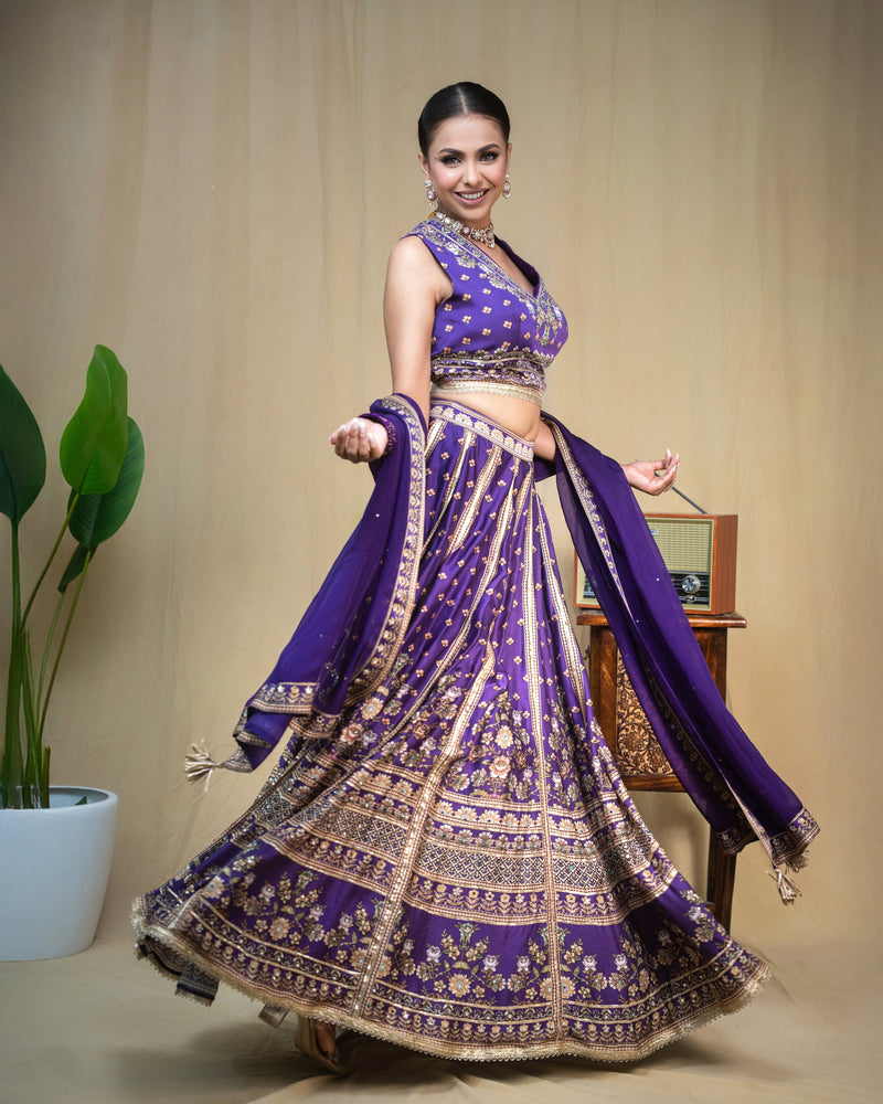 Full length shot of deep purple hand embroidered modal lehenga set for festive occasions