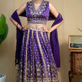 Detail of fine floral print and embroidery on purple modal lehenga skirt hem