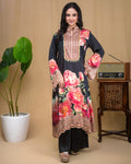 Close-up of hand embroidery, mirror work, and coin lace trim on black floral modal tunic.