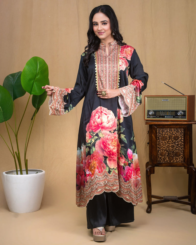Full-length shot of a black floral modal Indo-Western dress with scalloped hemline.