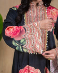 Scalloped hemline detail on a black floral printed modal dress with hand embroidery.