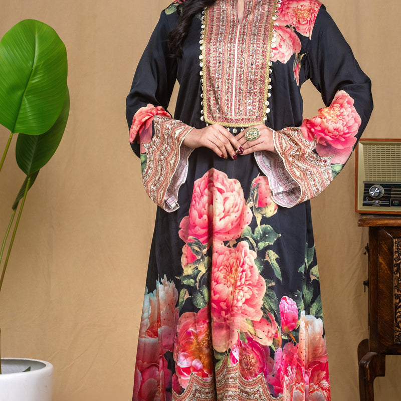 Festive black floral modal dress styled with wide-leg trousers for modern ethnic wear.