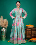 Full-length front view of a woman wearing a sea green printed georgette Indo-Western dress with embroidered yoke.