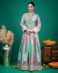 Close-up shot of the sea green georgette dress showing embroidered neckline, fabric buttons, and printed bodice.