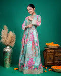 Side perspective view showcasing the flowing floor-length flare of the sea green printed georgette dress.
