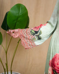Full back view of the flared sea green printed georgette dress with elegant traditional print patterns.