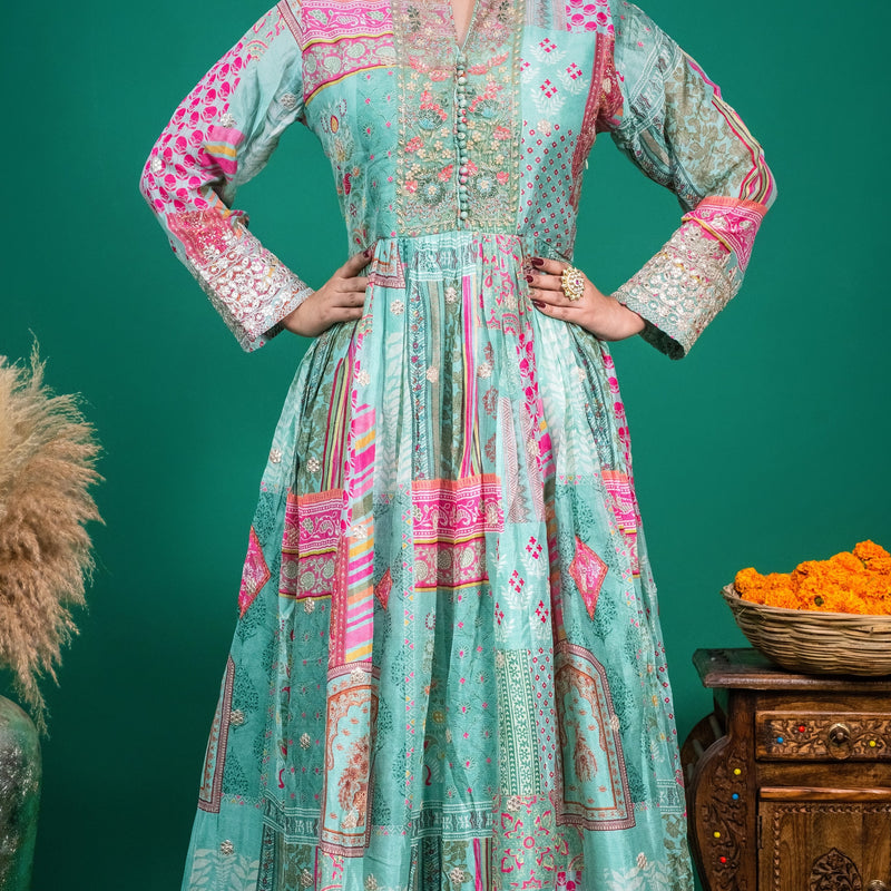 Styled full-length shot of the sea green printed georgette dress paired with traditional Indian statement jewellery.