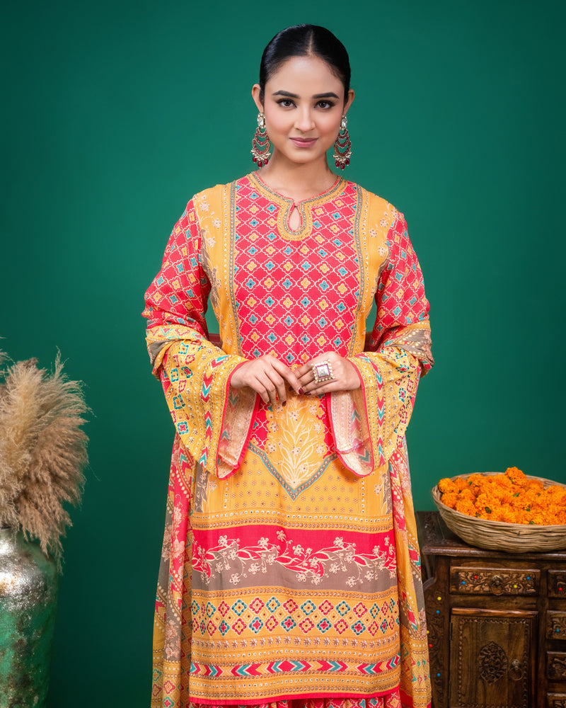 Close-up of delicate printed border detailing on the hem of coral georgette kurta.