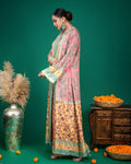 Model posing in pink and yellow panelled printed modal Indo-western ensemble with green backdrop