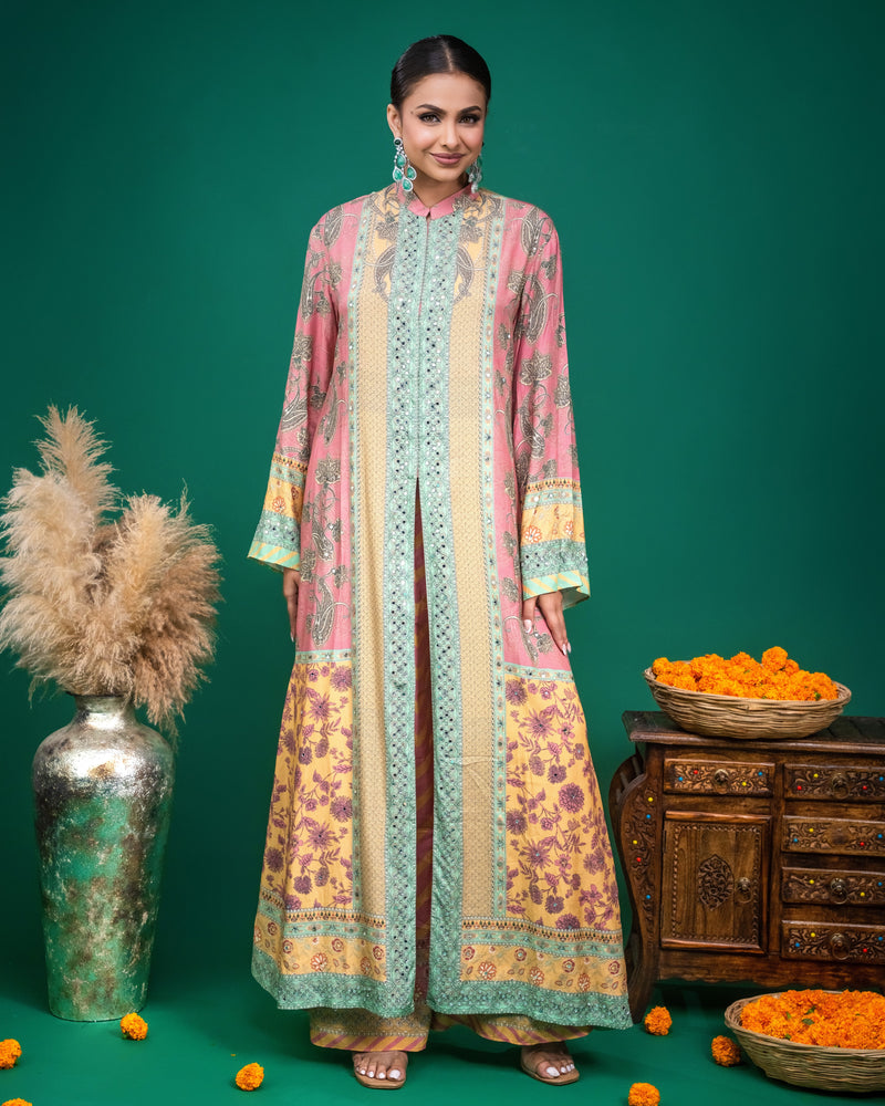 Close-up showing fine threadwork and mirror embroidery on mint green border of modal dress