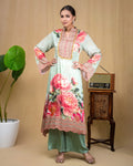 Side profile view of mint green floral Indo-western dress with wide bell sleeves.