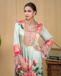 Close-up of intricate scalloped hand embroidery along the hem of mint modal dress.