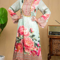 Full-length view of mint green floral modal Indo-western dress and flared pants.