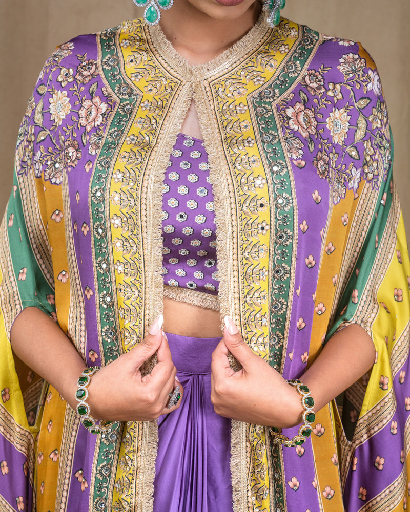 Fabric detail shot highlighting the soft purple modal texture, floral cape print, and mirror work.