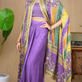 Full shot of the purple modal drape set styled with vintage decor for a festive look.