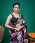 Detailed view of the fine zari work on the border of the black floral organza saree