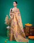 Detailed view of the embroidered scalloped border on a beige floral print organza saree drape.